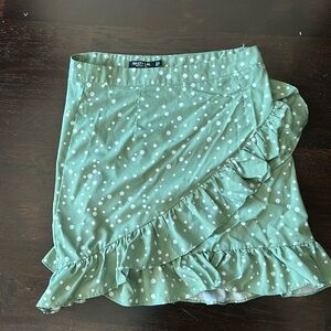 Green and white polka dot skirt